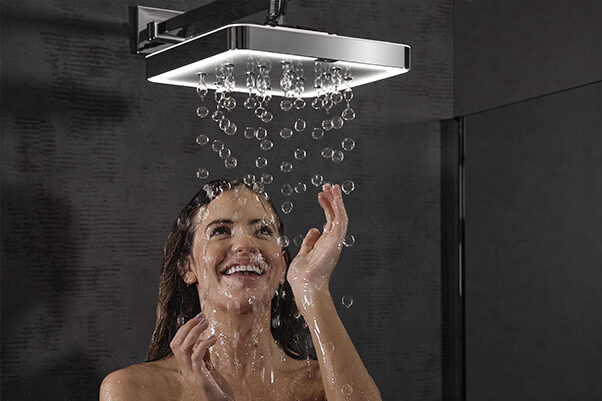 Lady enjoying the unique BubbleSpa air-powered shower.